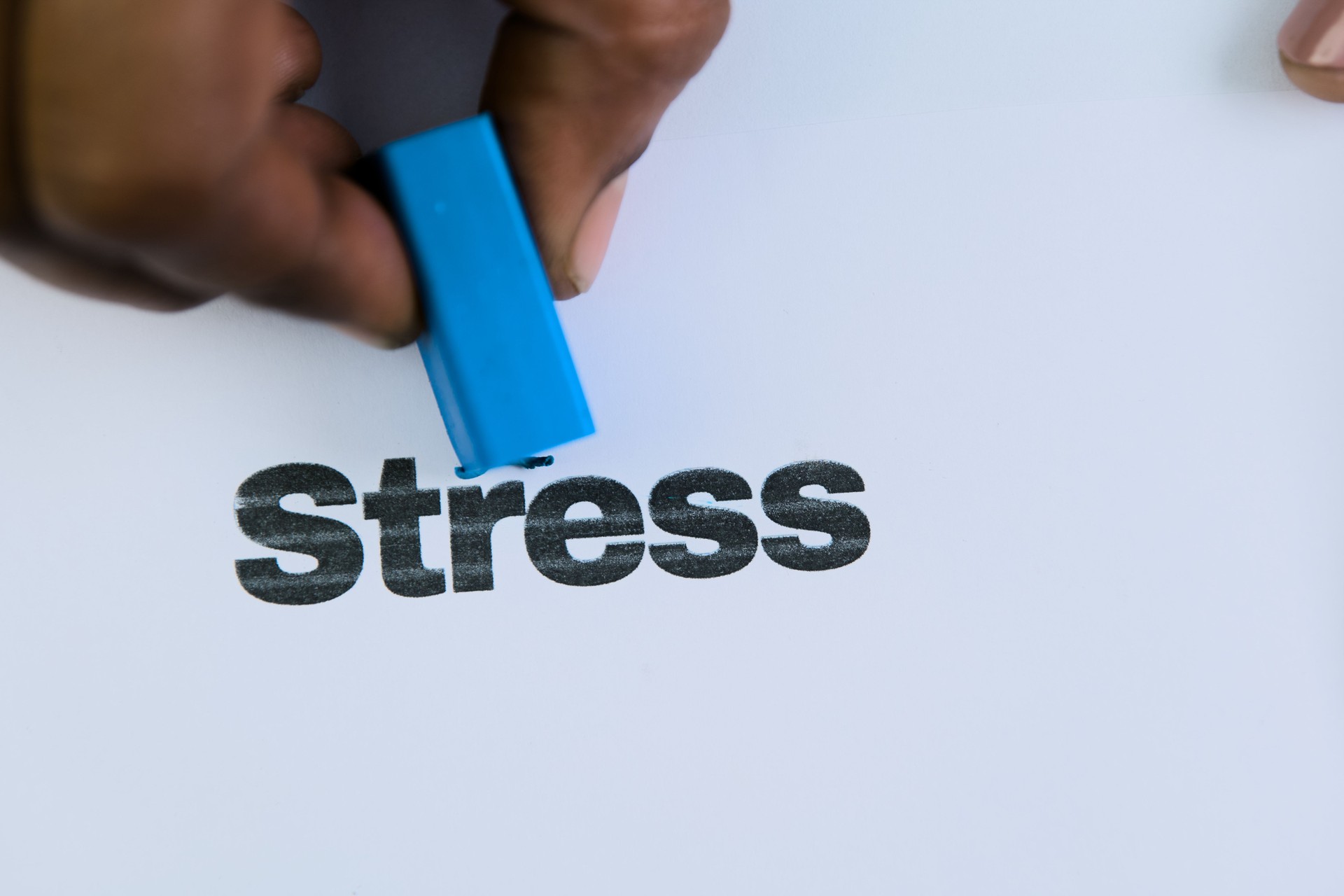 Erasing stress with a blue marker on paper